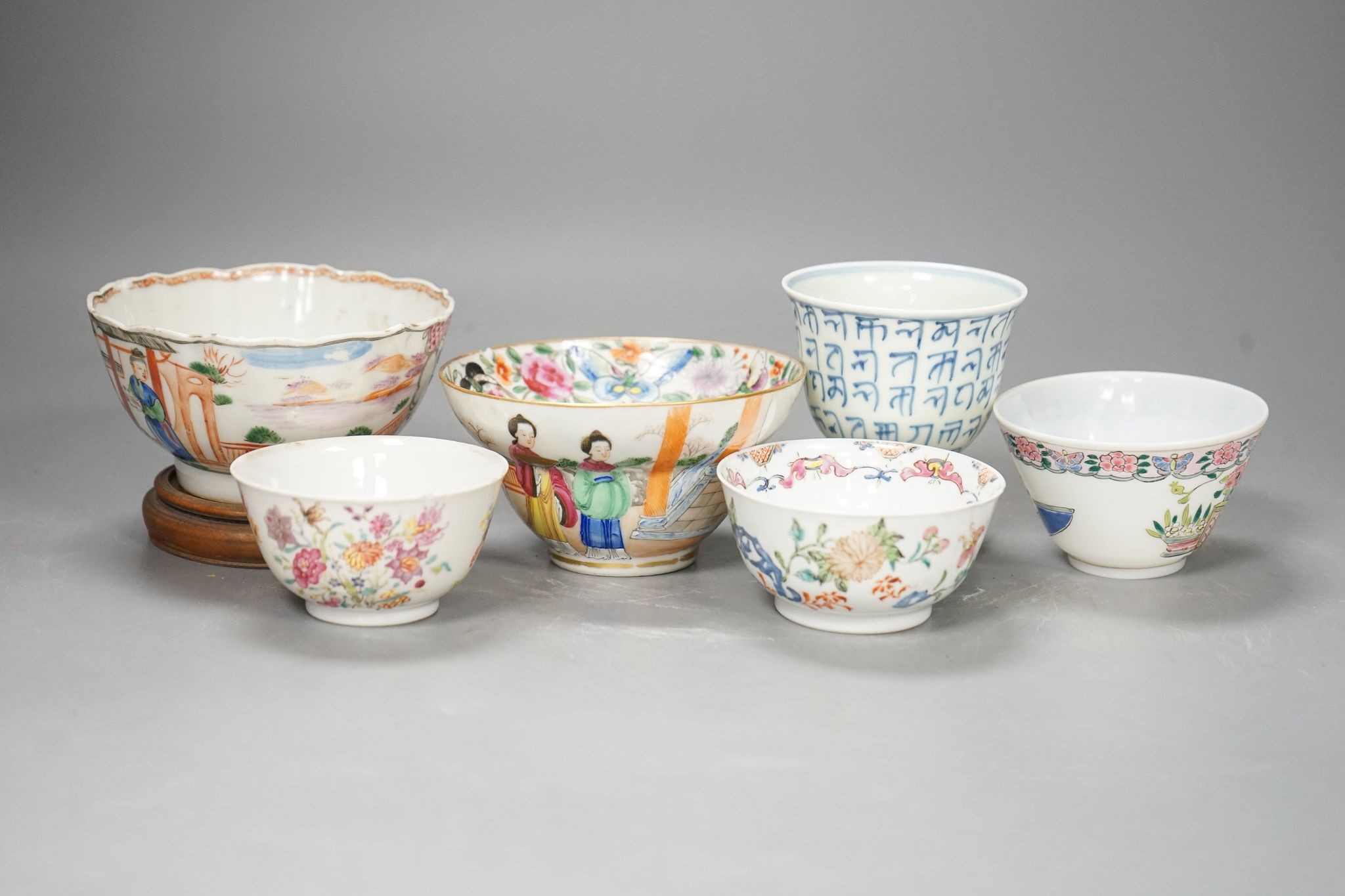 Six Chinese bowls or cups, 18th century or later, largest 11cm diam.